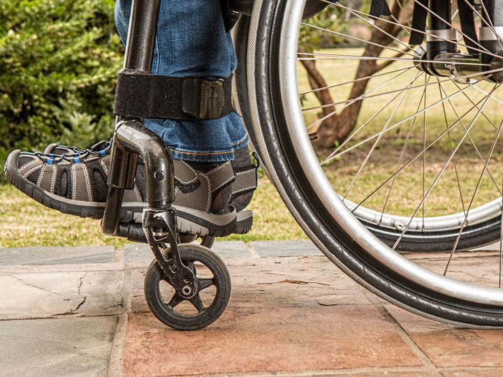 close-up of legs in a wheelchair