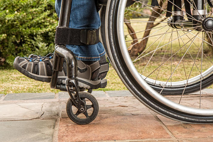 close-up of legs in a wheelchair